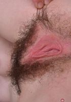 Emma tugs on her lady fur., Emma Evins (emm030) ATK Natural & Hairy: Emma Evins (Emma tugs on her lady fur.)